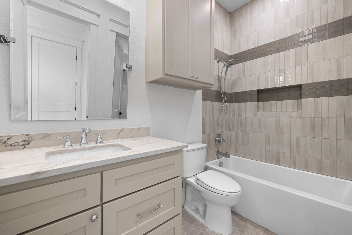 424 Pleasant Hill School Road Brenham, TX 77833 - Photo 16 of 26 a bathroom with a sink a toilet and a bathtub