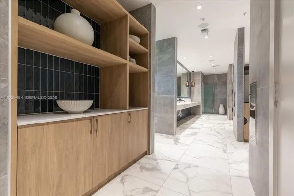 a bathroom with a tub and shower