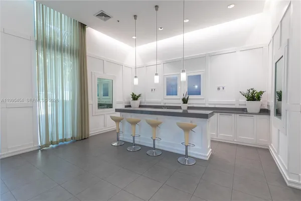 a kitchen with kitchen island a sink and counter space