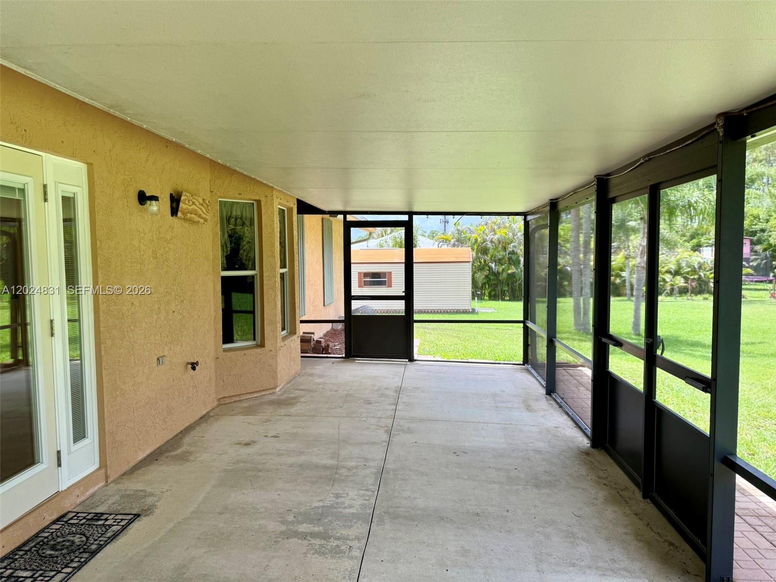 15819 76th Road North Loxahatchee, FL 33470 - Photo 29 of 45 a view of an entryway with a garden