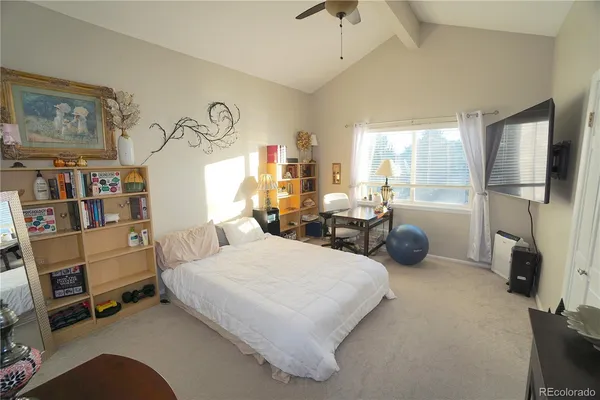 a bedroom with bed and a window