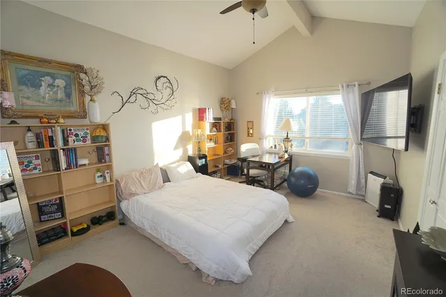 a bedroom with bed and a window