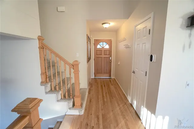 a view of entryway with wooden floor