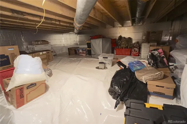 a utility room with dryer washer and a view of kitchen