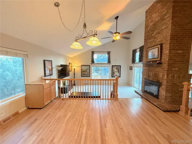 a view of a livingroom with furniture and a fireplace