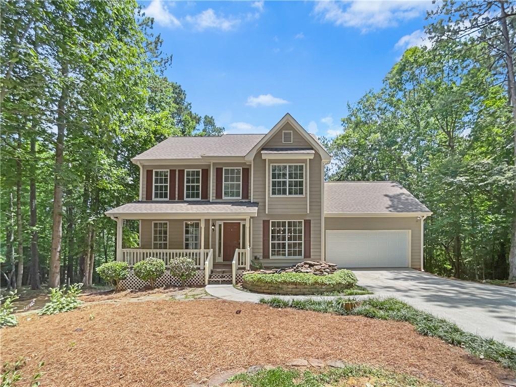 1730 River Bluff Road Monroe, GA 30656 - Photo 1 of 1 a front view of a house with a garden