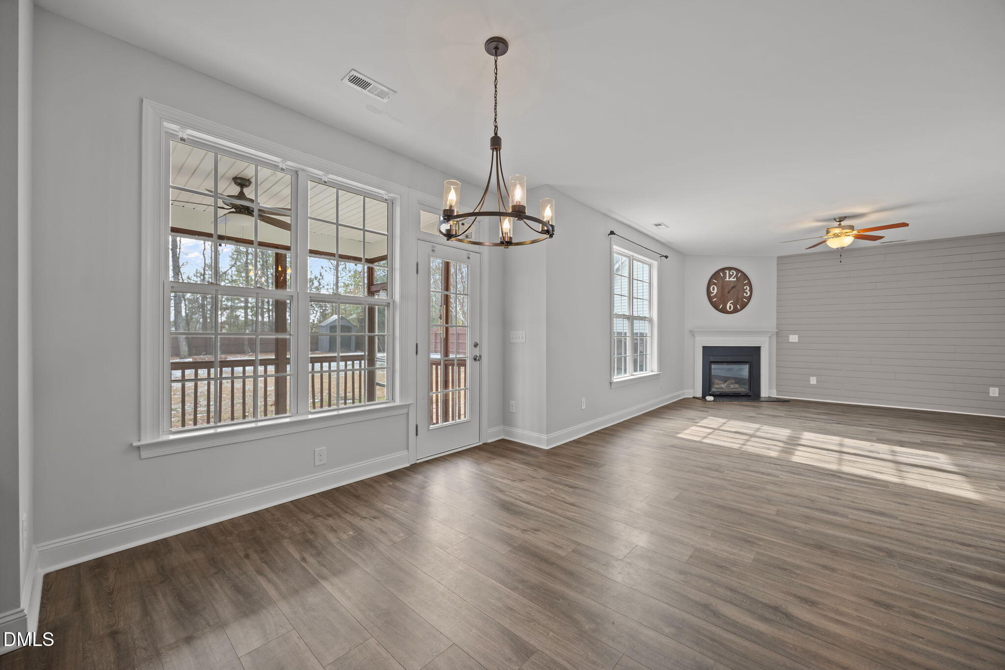 824 Lone Pine Loop Fuquay-Varina, NC 27526 - Photo 14 of 62 a view of an empty room with a window and wooden floor