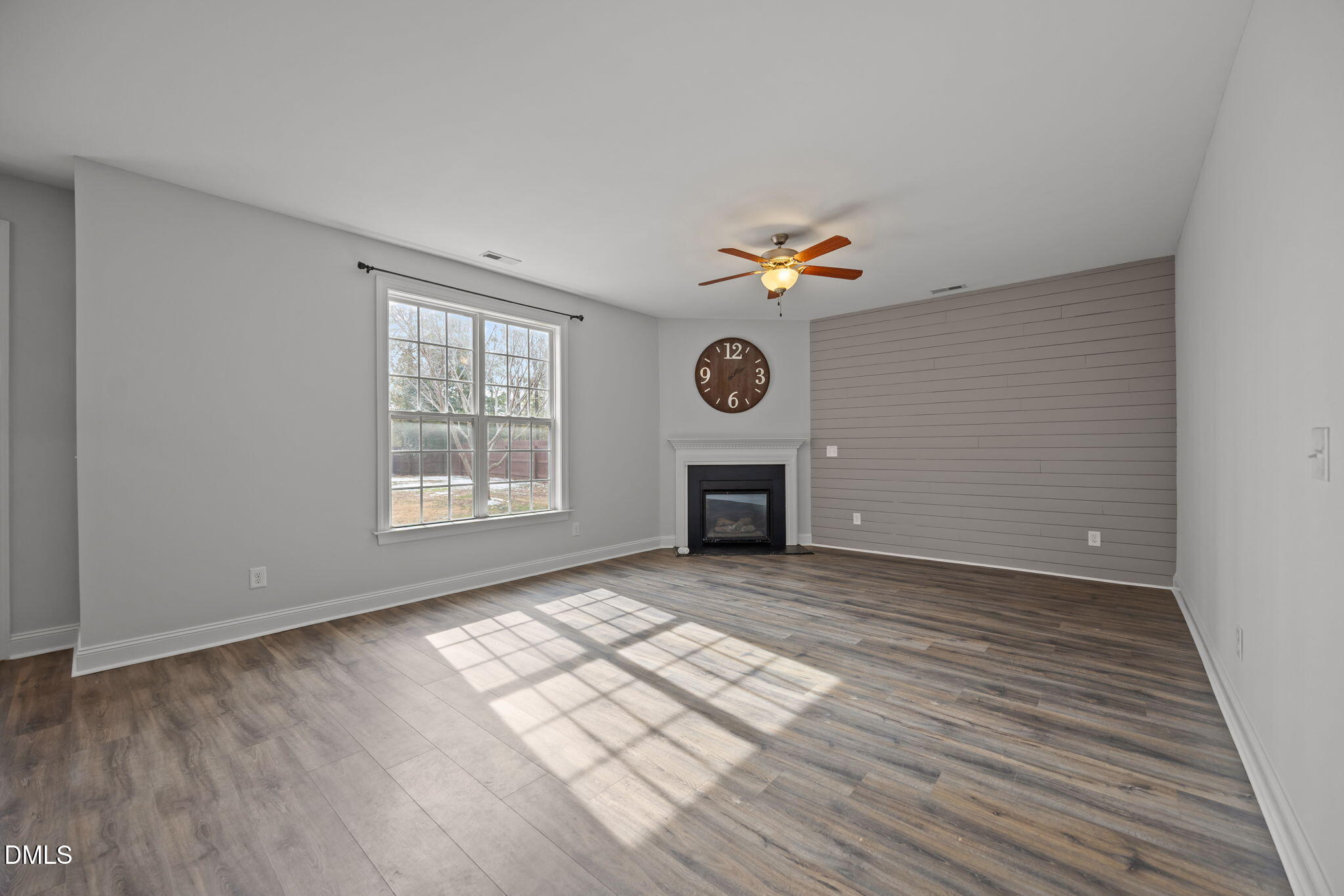 824 Lone Pine Loop Fuquay-Varina, NC 27526 - Photo 17 of 62 an empty room with windows and fireplace