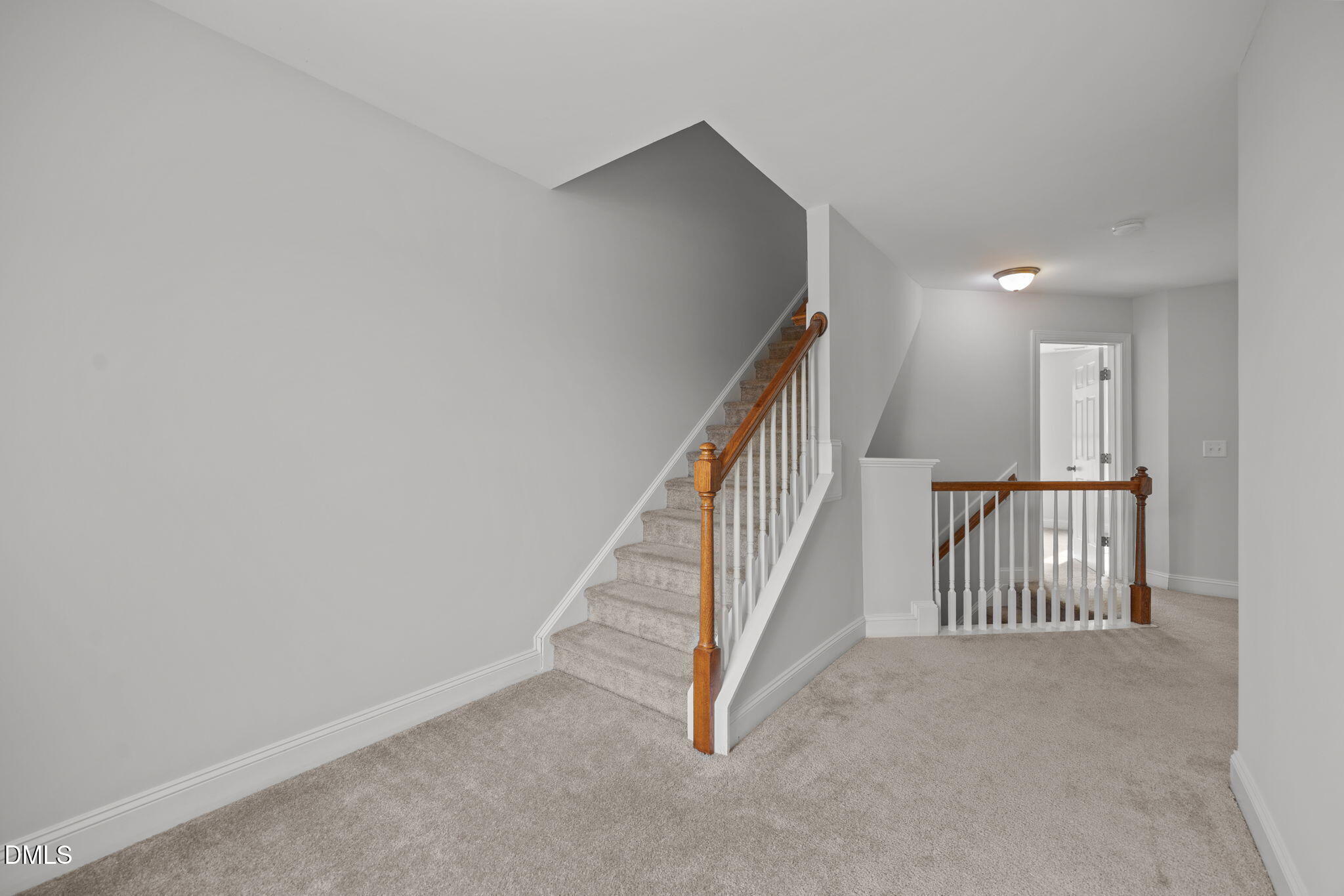 824 Lone Pine Loop Fuquay-Varina, NC 27526 - Photo 36 of 62 a view of a hallway with staircase