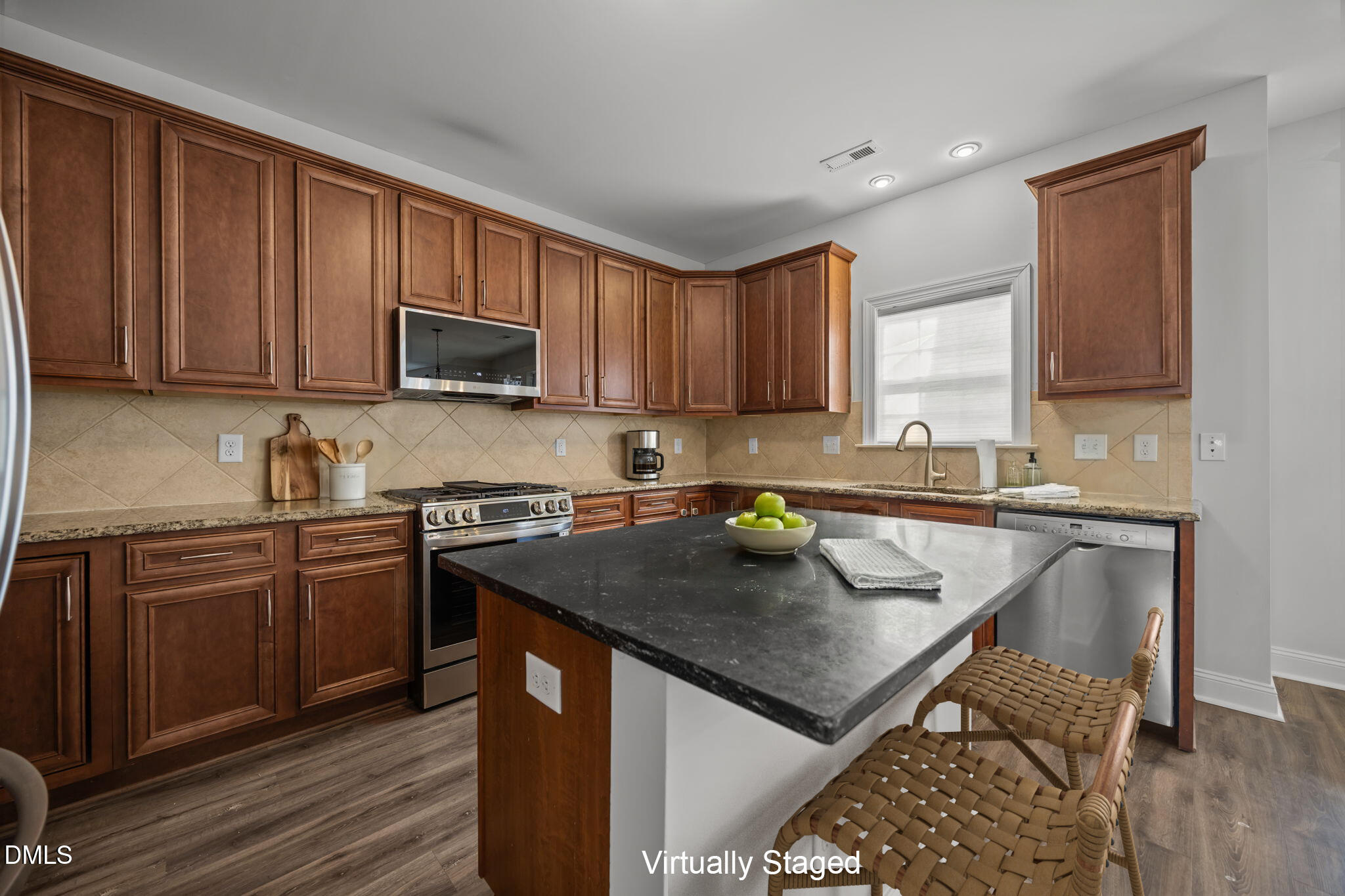 824 Lone Pine Loop Fuquay-Varina, NC 27526 - Photo 4 of 62 a kitchen with a stove sink and cabinets
