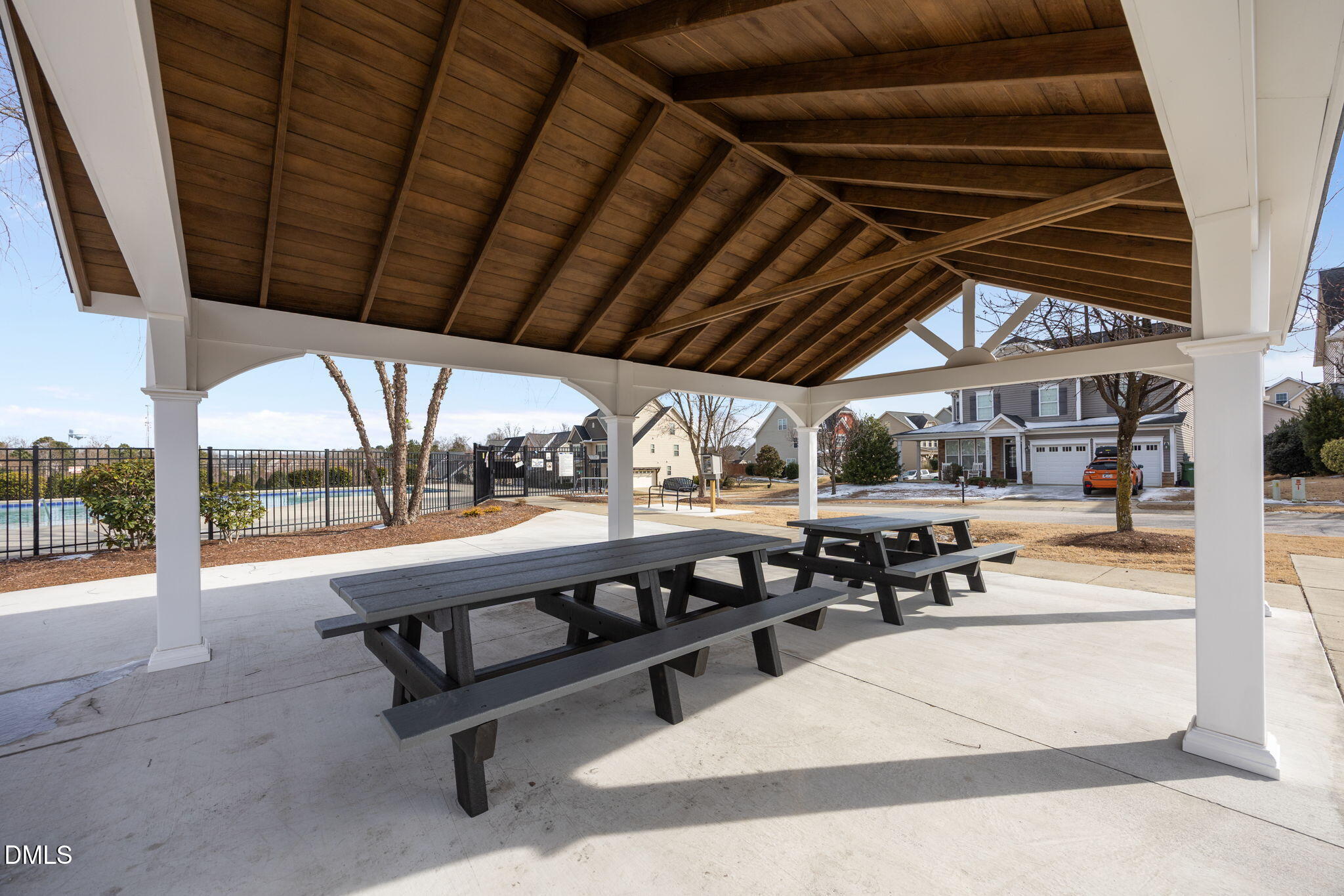 824 Lone Pine Loop Fuquay-Varina, NC 27526 - Photo 61 of 62 a view of a swimming pool with a porch