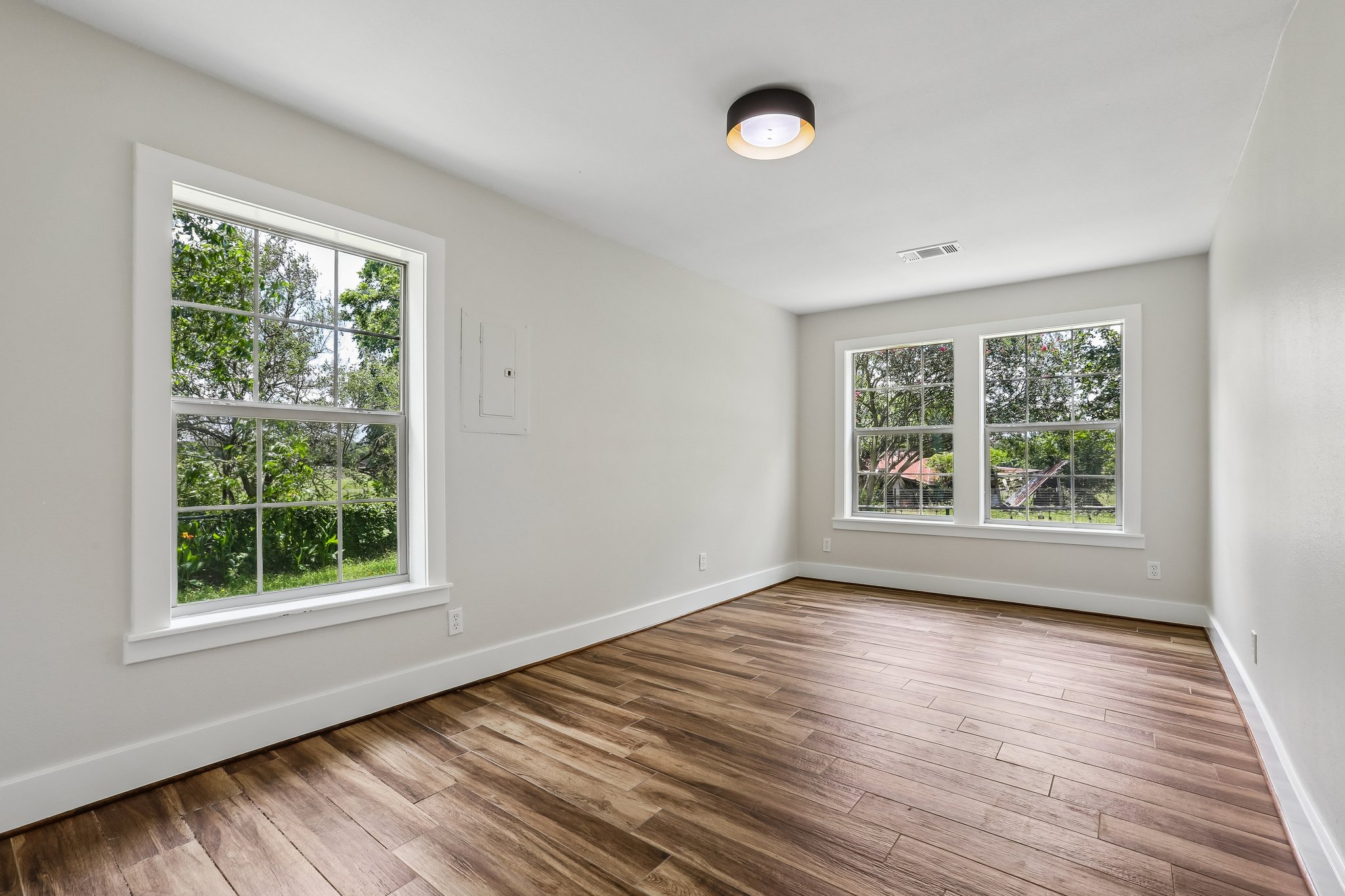 2089 Farm To Market Road 1704 Elgin, TX 78621 - Photo 15 of 31 Hardwood floors and generous windows create an airy, naturally illuminated space.