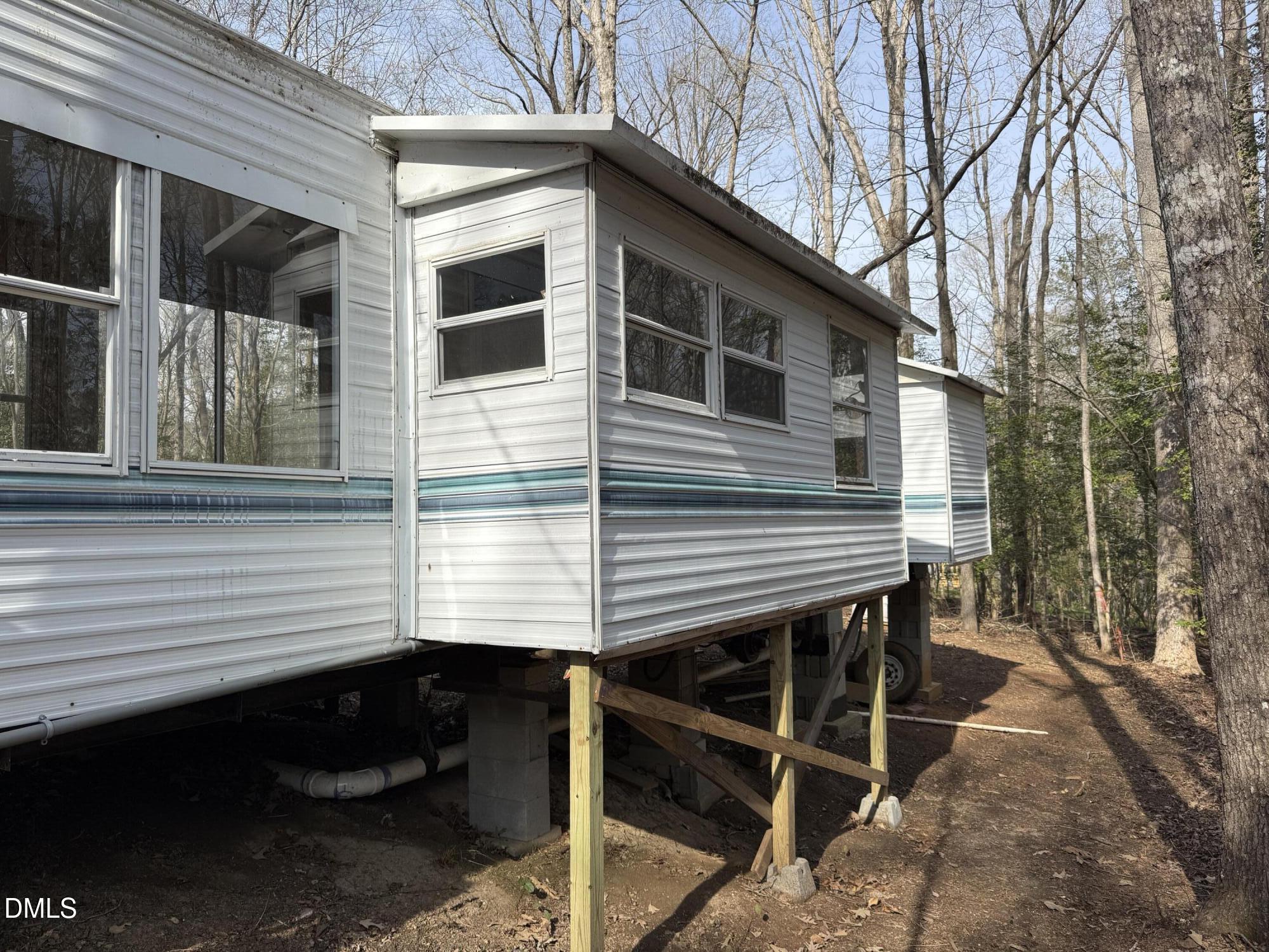 105 Kansas Drive Spring Hope, NC 27882 - Photo 12 of 54 a view of a house with a wooden deck