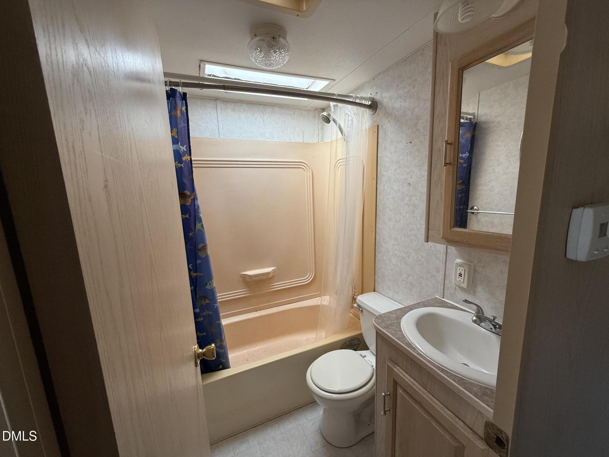 105 Kansas Drive Spring Hope, NC 27882 - Photo 20 of 54 a bathroom with a sink toilet and shower