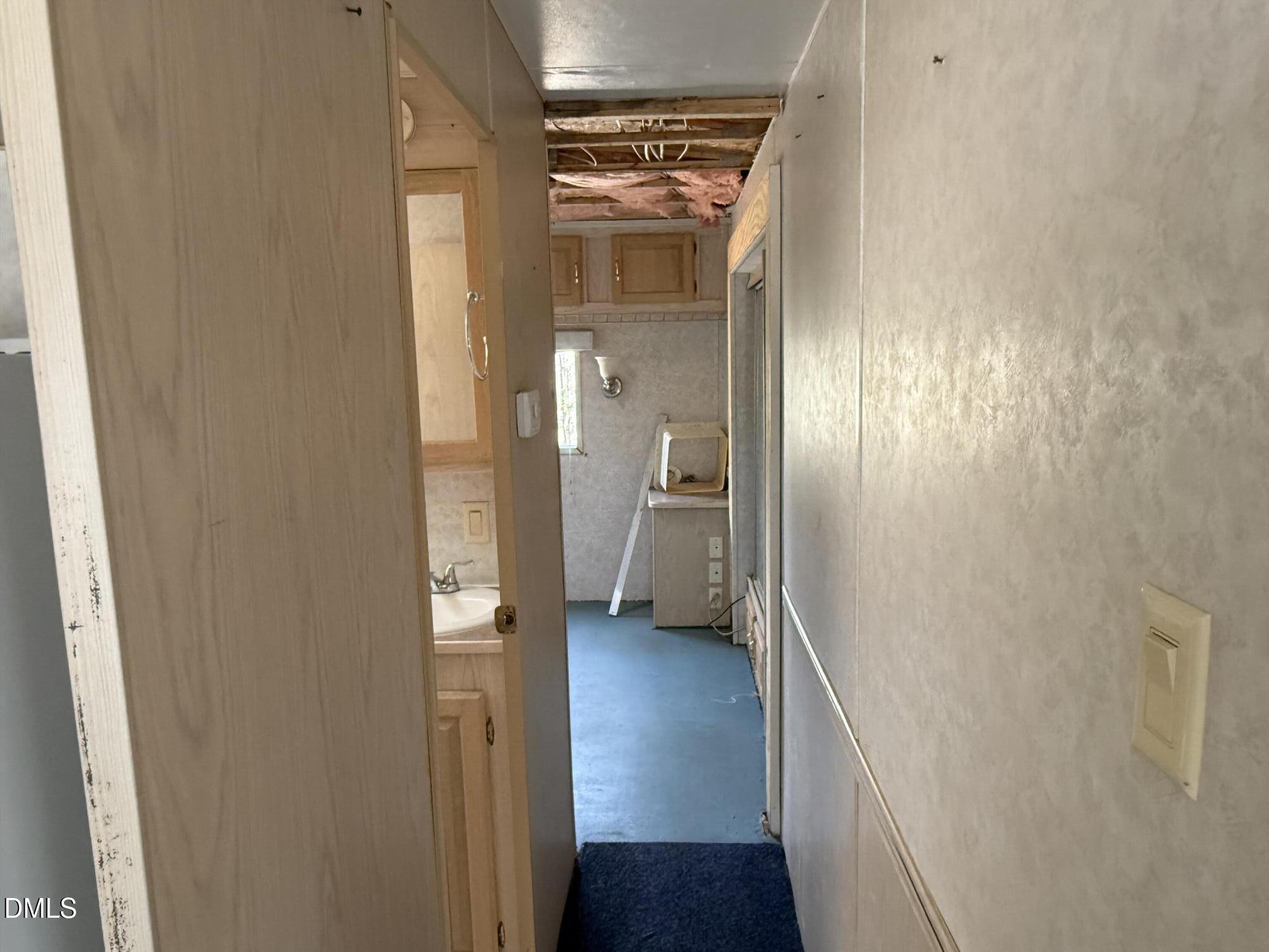 105 Kansas Drive Spring Hope, NC 27882 - Photo 21 of 54 a view of a hallway with wooden floor and a bathroom