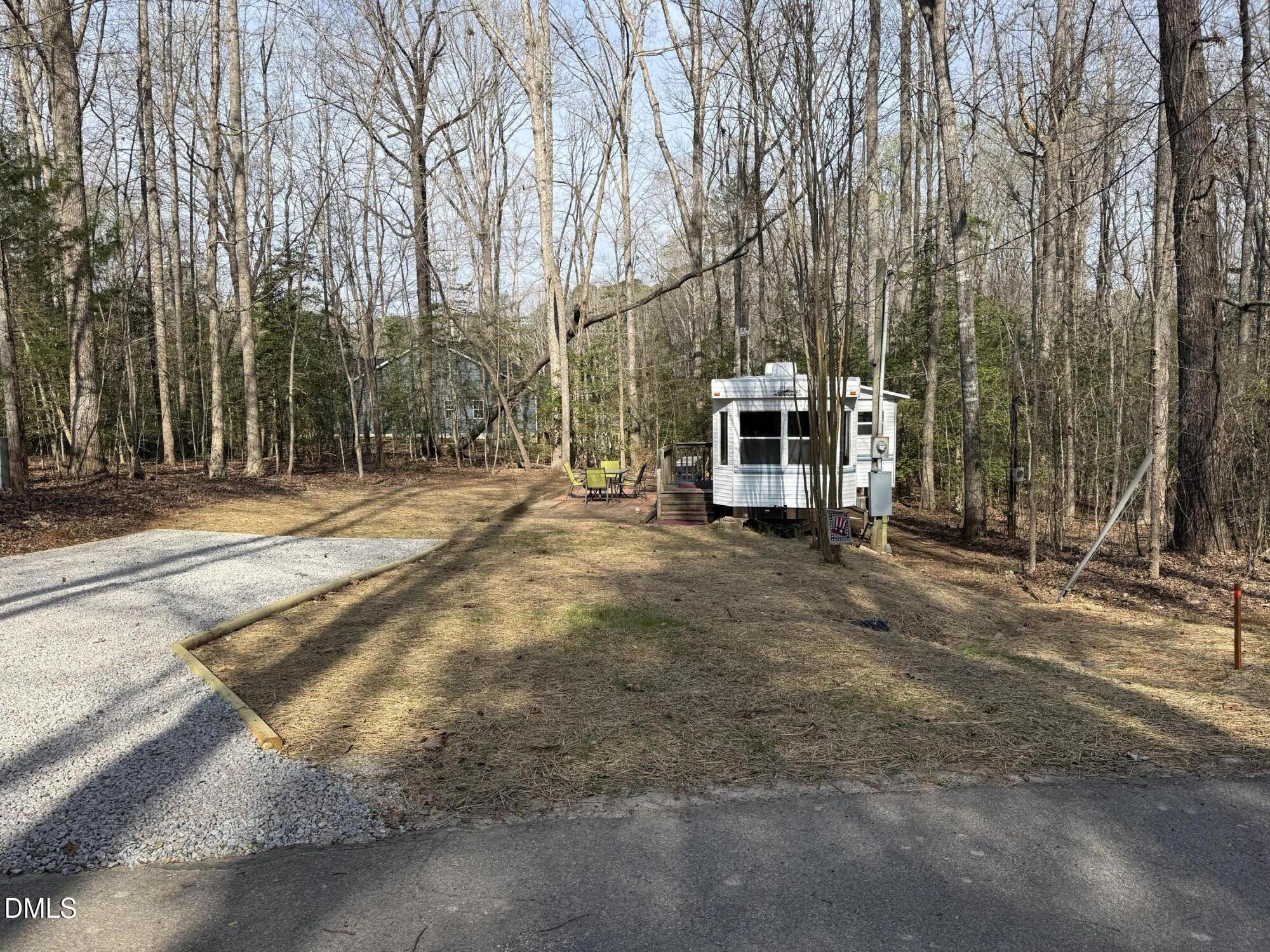 105 Kansas Drive Spring Hope, NC 27882 - Photo 3 of 54 a view of a house with a yard and large trees
