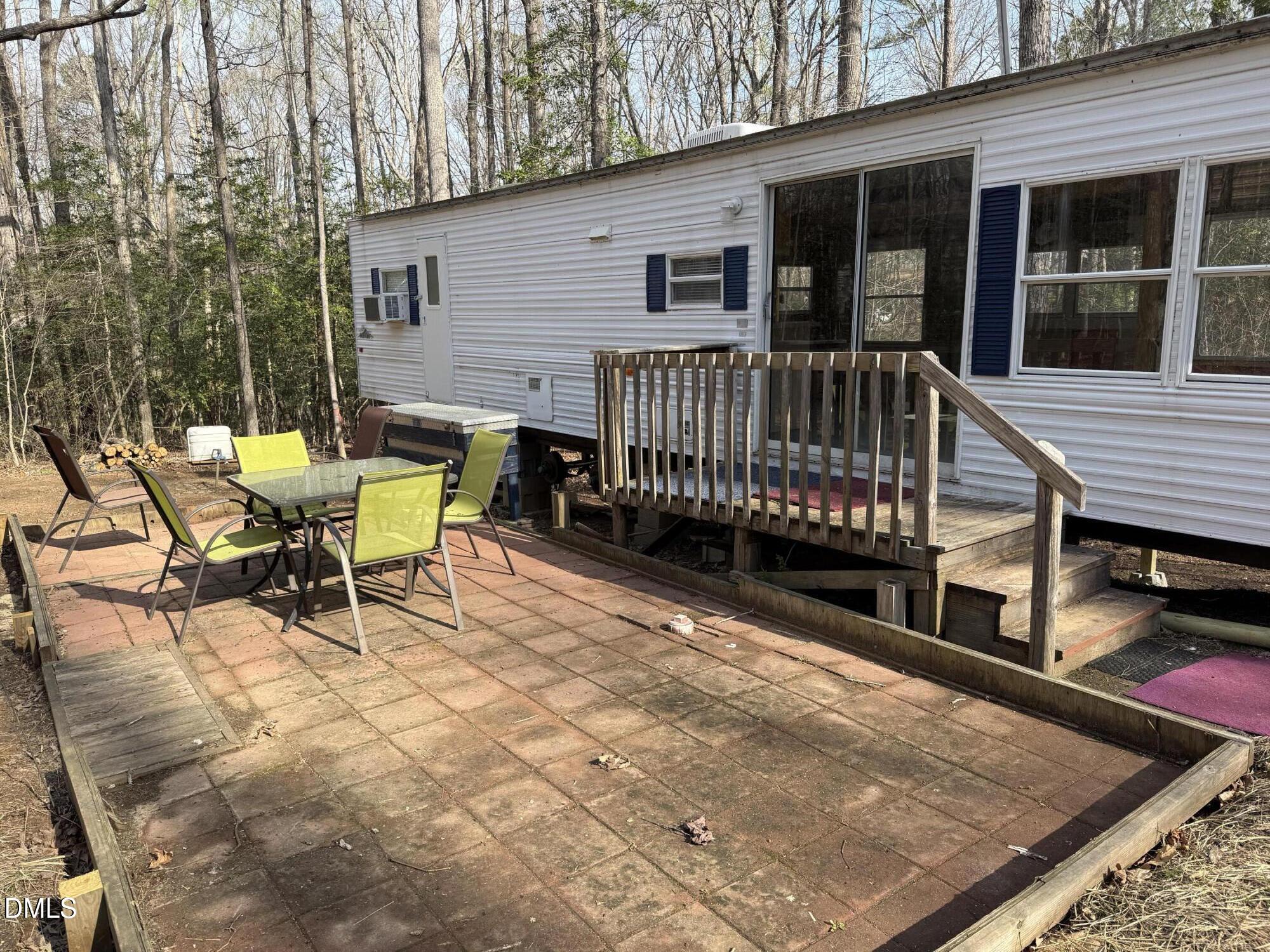 105 Kansas Drive Spring Hope, NC 27882 - Photo 8 of 54 a view of a house with wooden deck and furniture