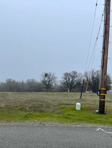 a view of a lake with a big yard