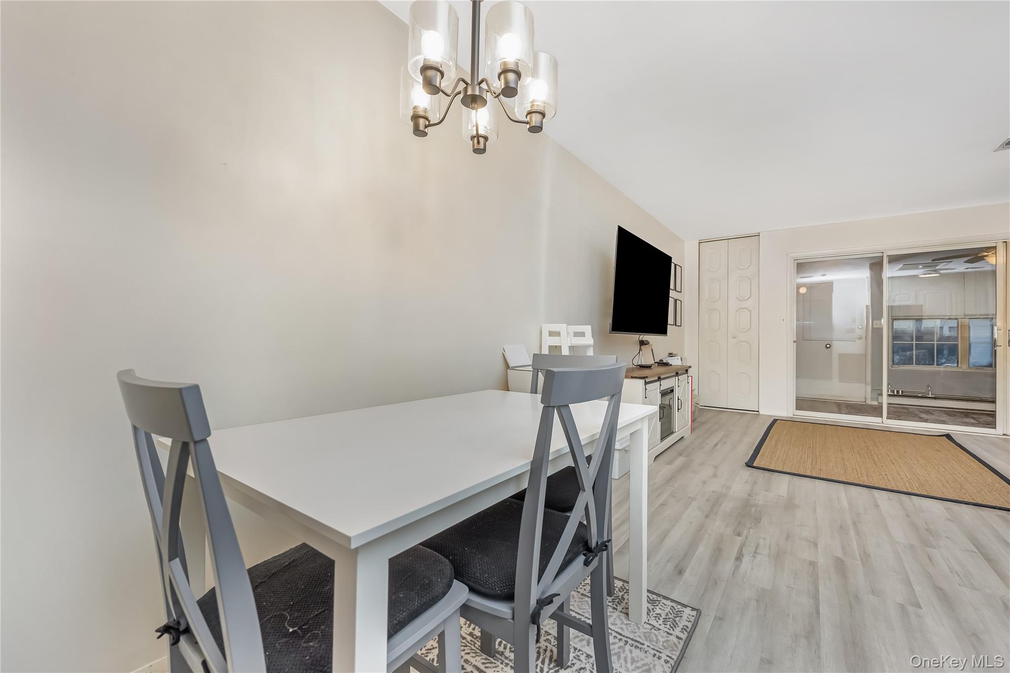 406 Woodbridge Drive, Unit B Ridge, NY 11961 - Photo 12 of 15 a view of a dining room with furniture and wooden floor