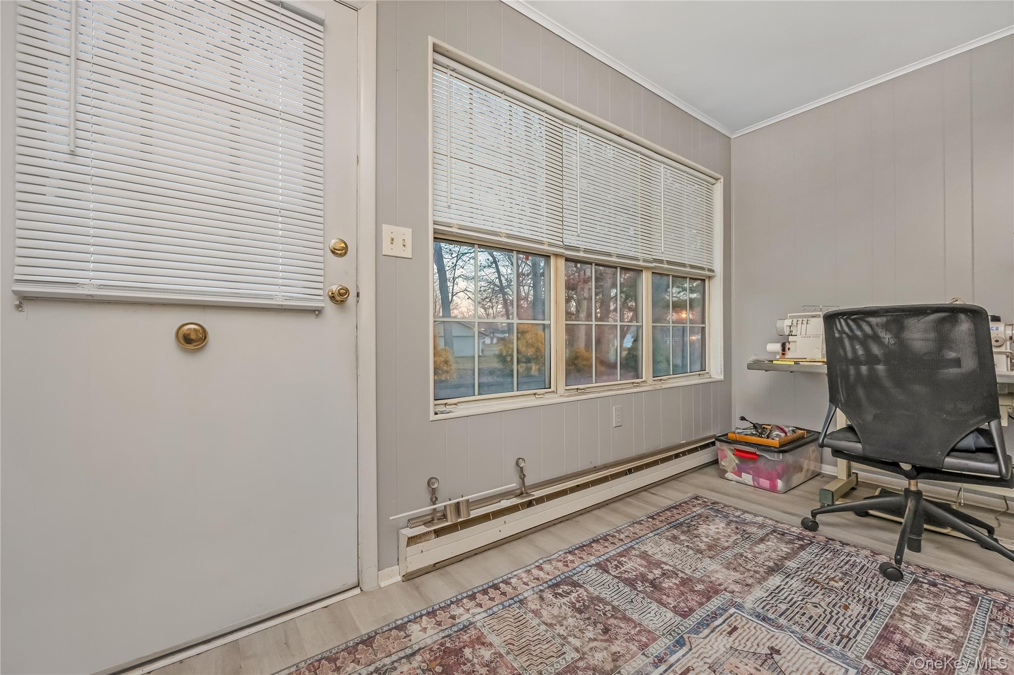 406 Woodbridge Drive, Unit B Ridge, NY 11961 - Photo 4 of 15 a living room with furniture and a window
