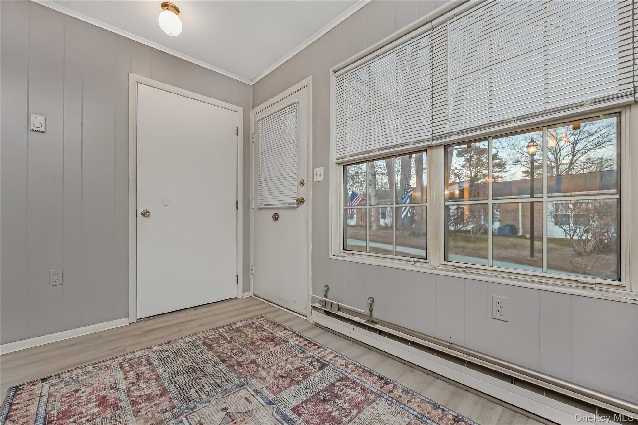 406 Woodbridge Drive, Unit B Ridge, NY 11961 - Photo 5 of 15 a view of an empty room with a window