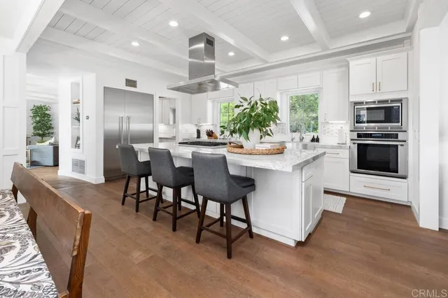 a large kitchen with a large window