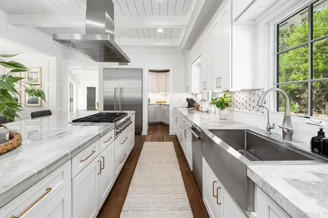 a kitchen with sink cabinets and window