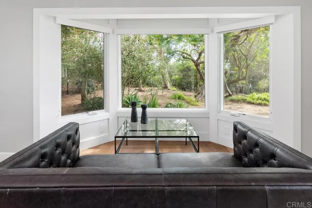 a bathroom with a sink a mirror and a shower