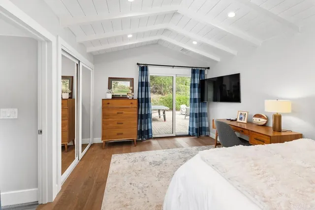 a bedroom with a bed and a lamp on table