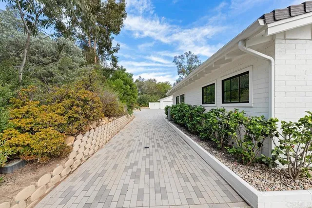 a view of a backyard with couple of trees