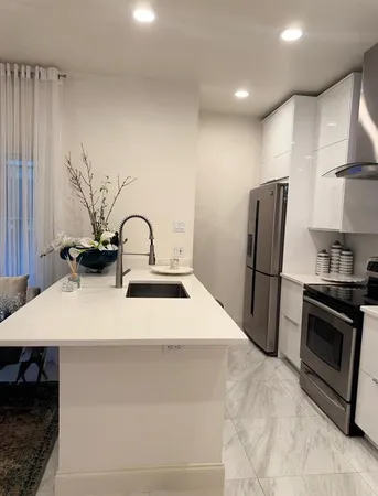 a close view of sink and refrigerator