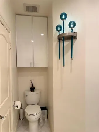 a bathroom with a toilet and a sink