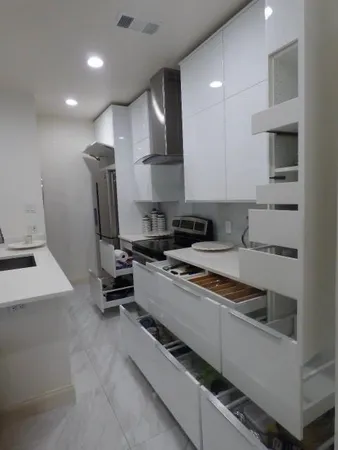 a kitchen with a sink stainless steel appliances and cabinets