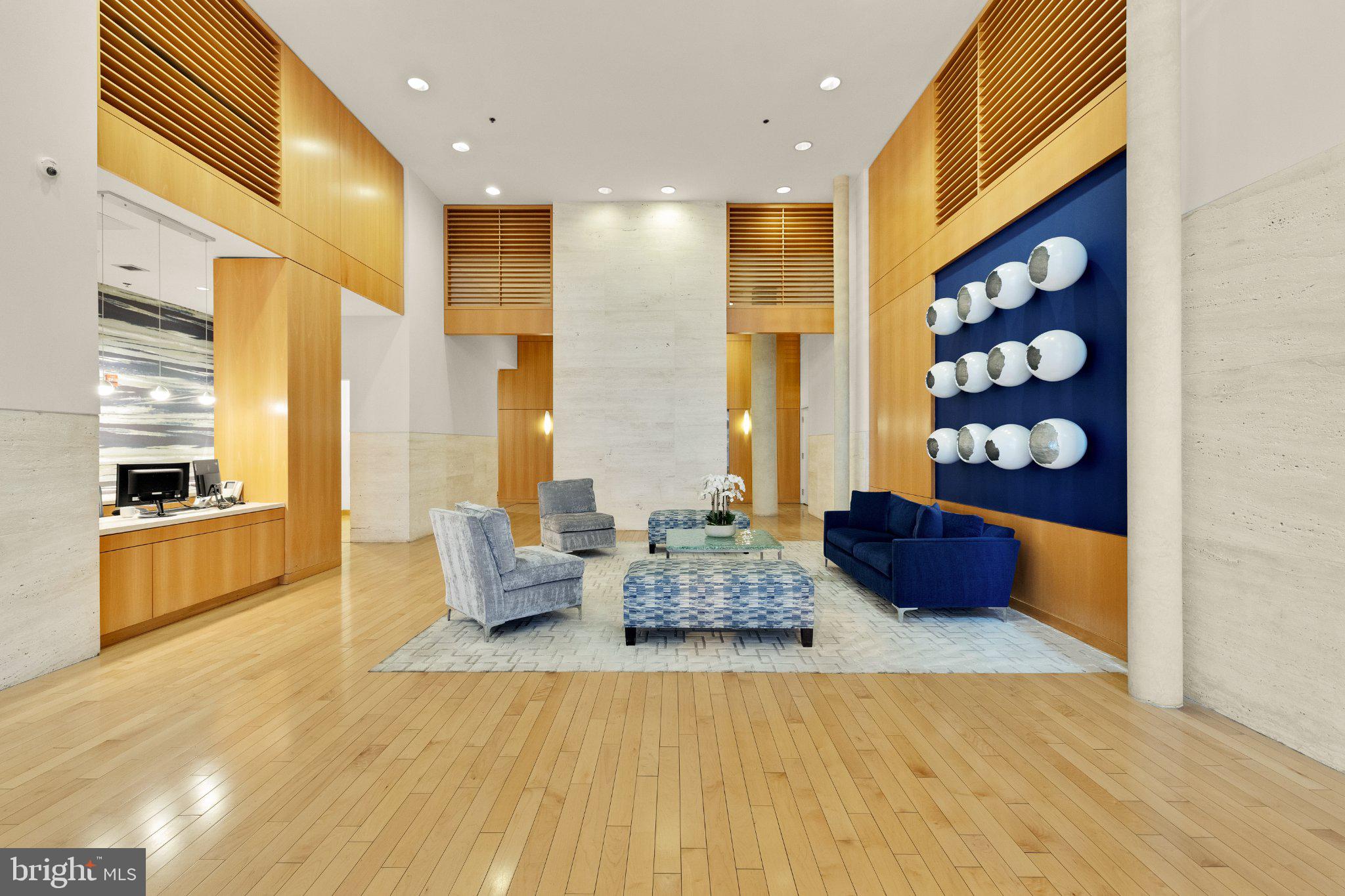 675 E Street Northwest, Unit 350 Washington, DC 20004 - Photo 3 of 29 Modern elegance in a spacious lobby.