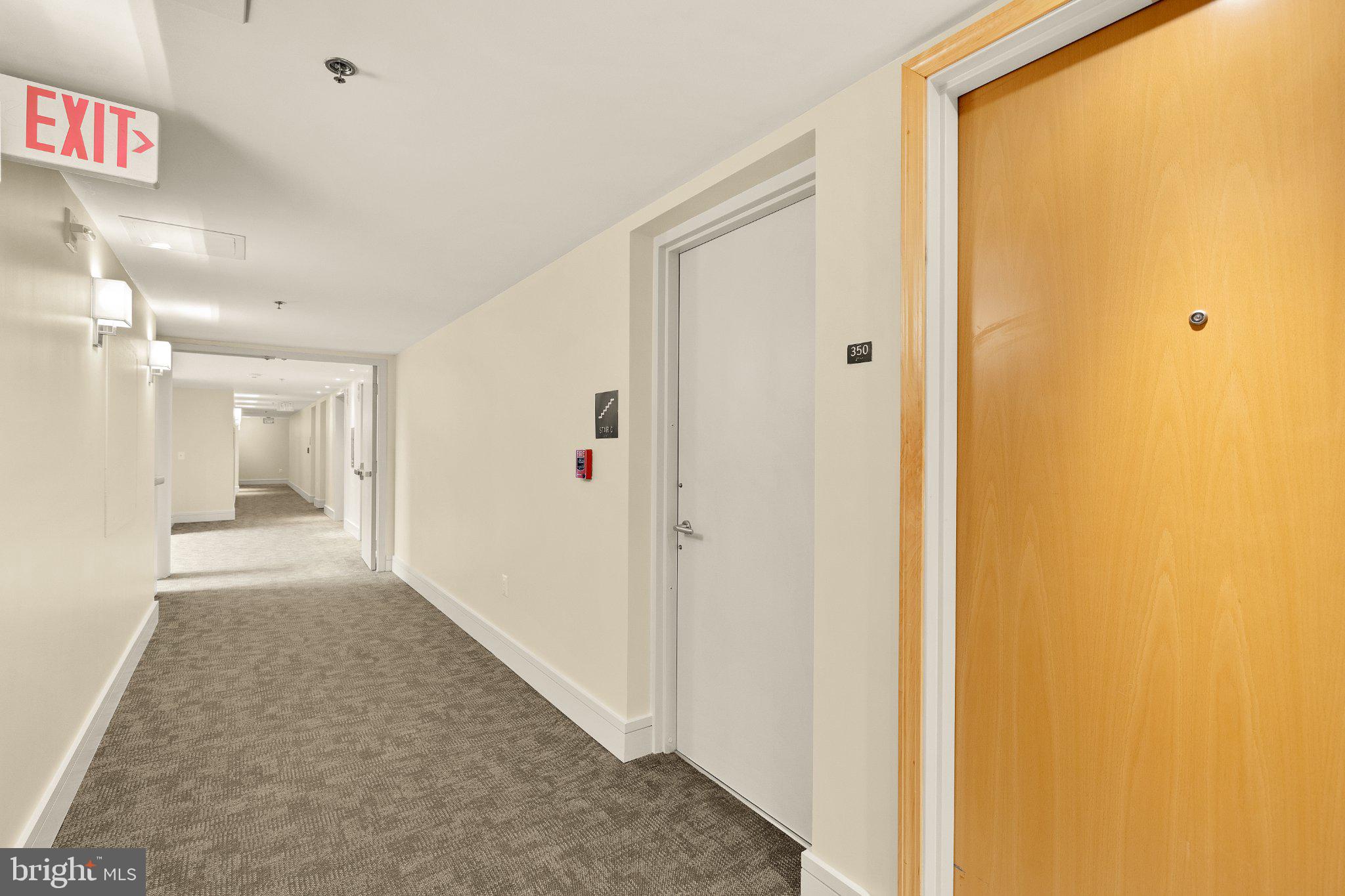 675 E Street Northwest, Unit 350 Washington, DC 20004 - Photo 5 of 29 Inviting corridor with modern design.