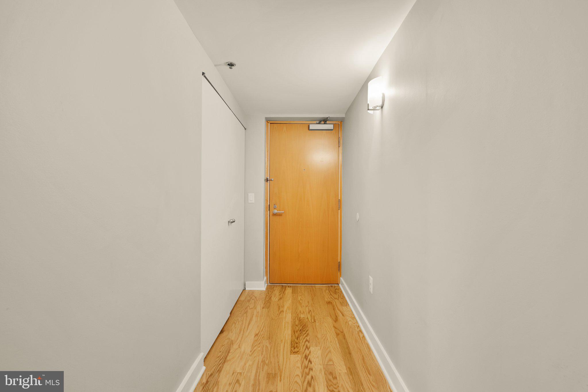 675 E Street Northwest, Unit 350 Washington, DC 20004 - Photo 6 of 29 Inviting entryway with warm tones.