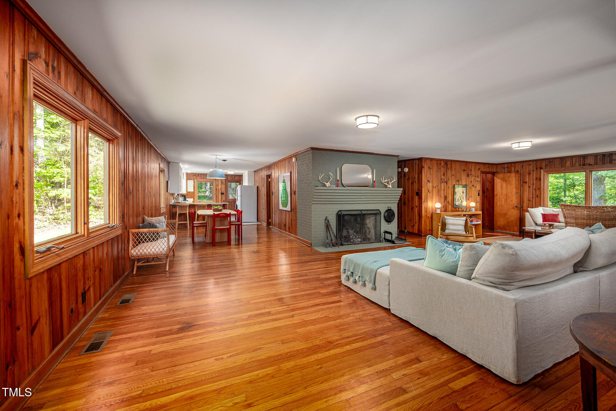 7723 Johnson Mill Road Bahama, NC 27503 - Photo 11 of 58 a living room with fireplace furniture and a wooden floor