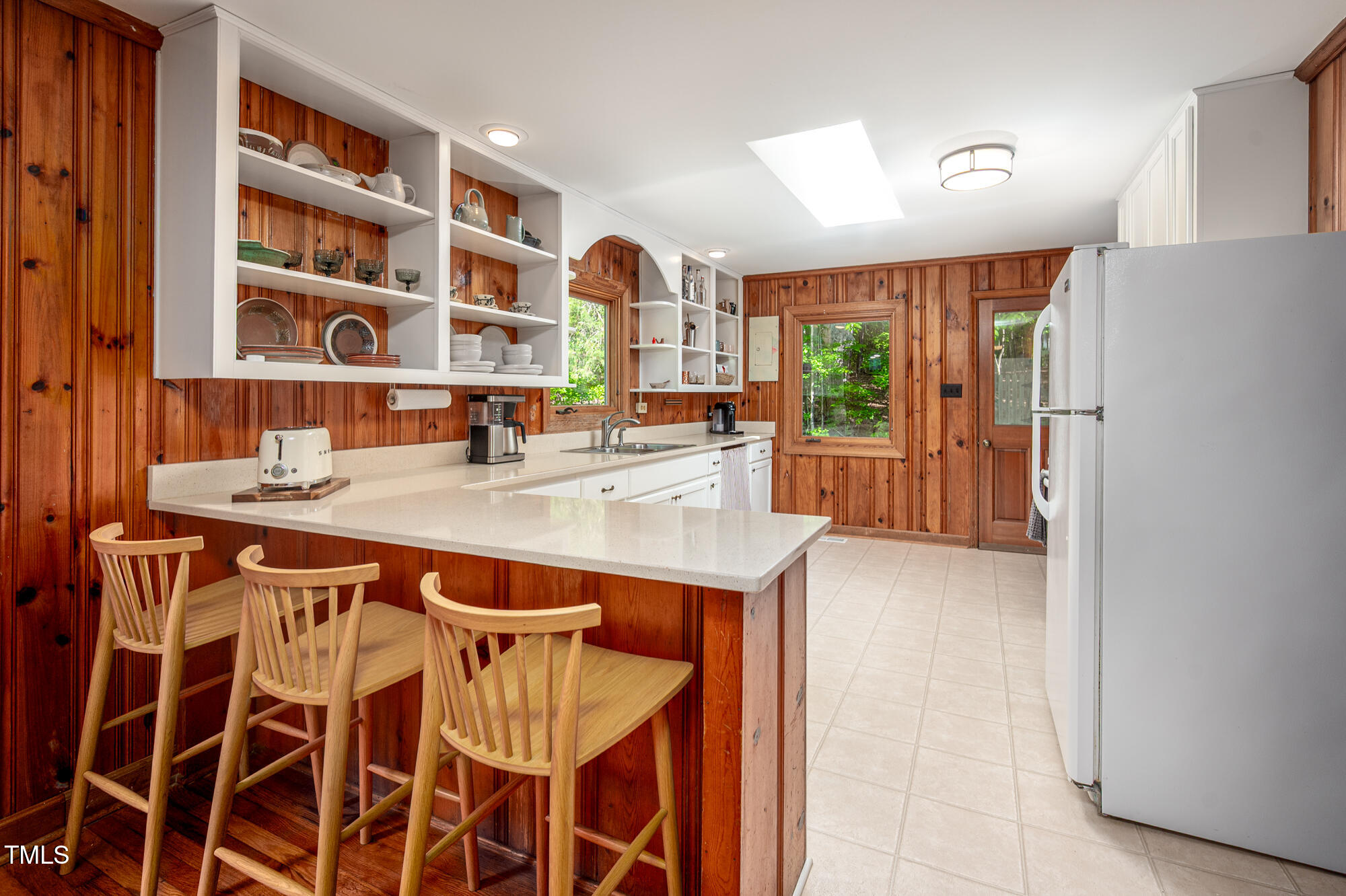 7723 Johnson Mill Road Bahama, NC 27503 - Photo 14 of 58 a dining hall with stainless steel appliances granite countertop a stove and a refrigerator