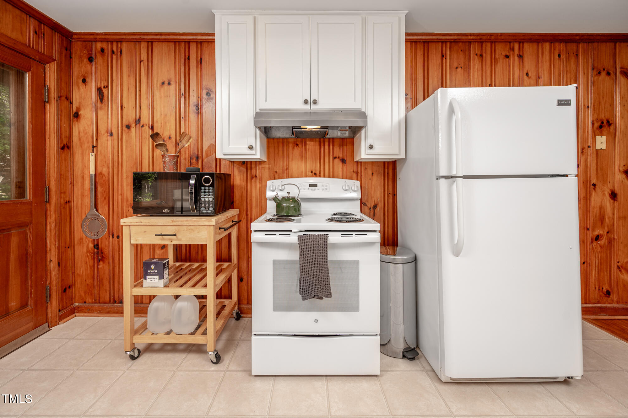 7723 Johnson Mill Road Bahama, NC 27503 - Photo 16 of 58 a white refrigerator freezer and a stove sitting inside of a kitchen