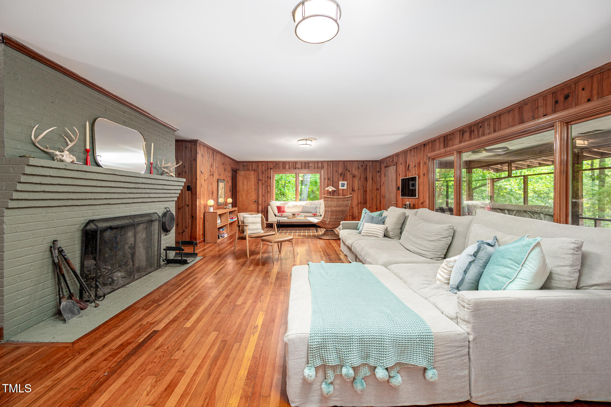 7723 Johnson Mill Road Bahama, NC 27503 - Photo 19 of 58 a living room with furniture and a fireplace