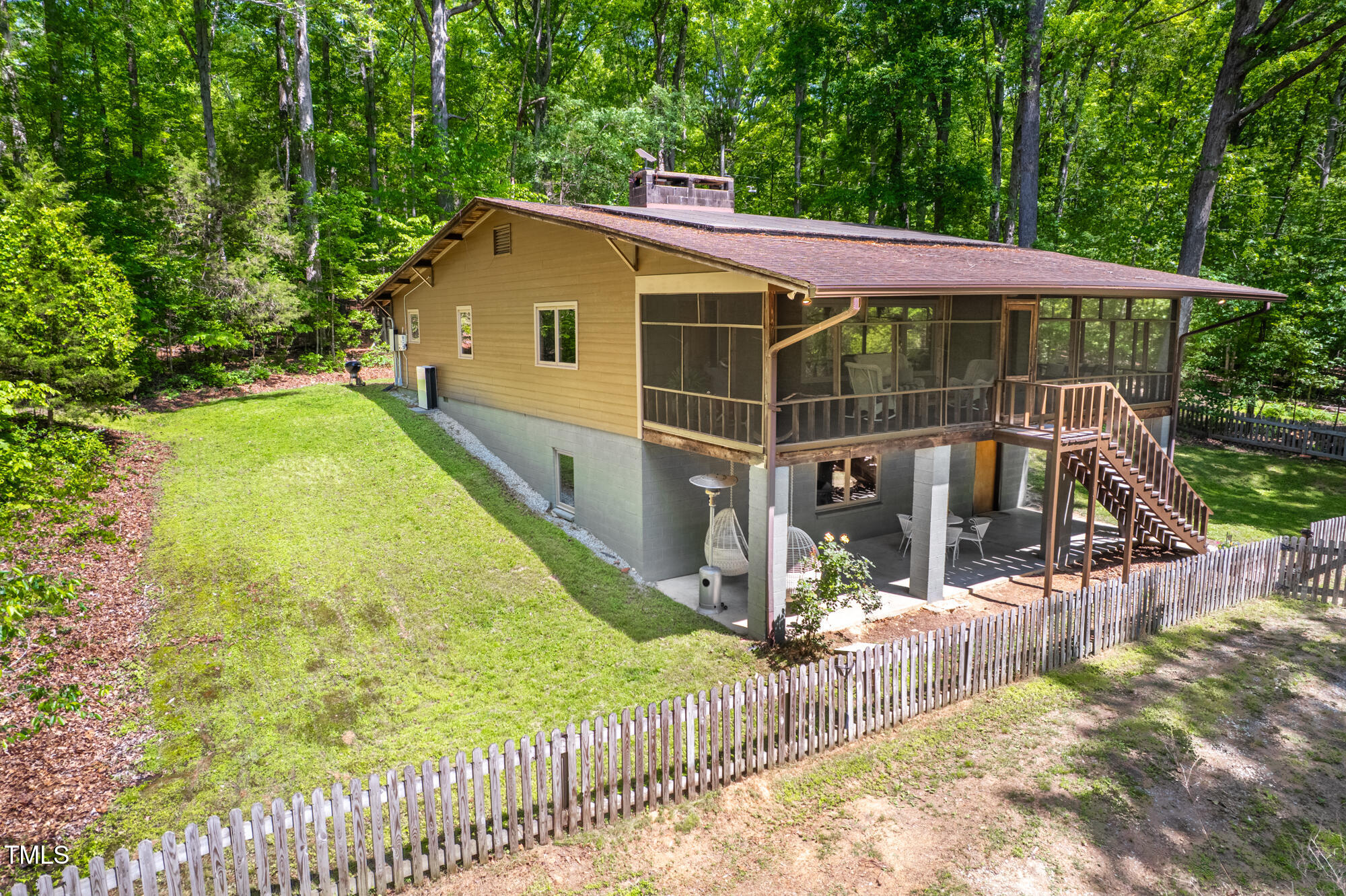 7723 Johnson Mill Road Bahama, NC 27503 - Photo 2 of 58 a view of a house with backyard and sitting area