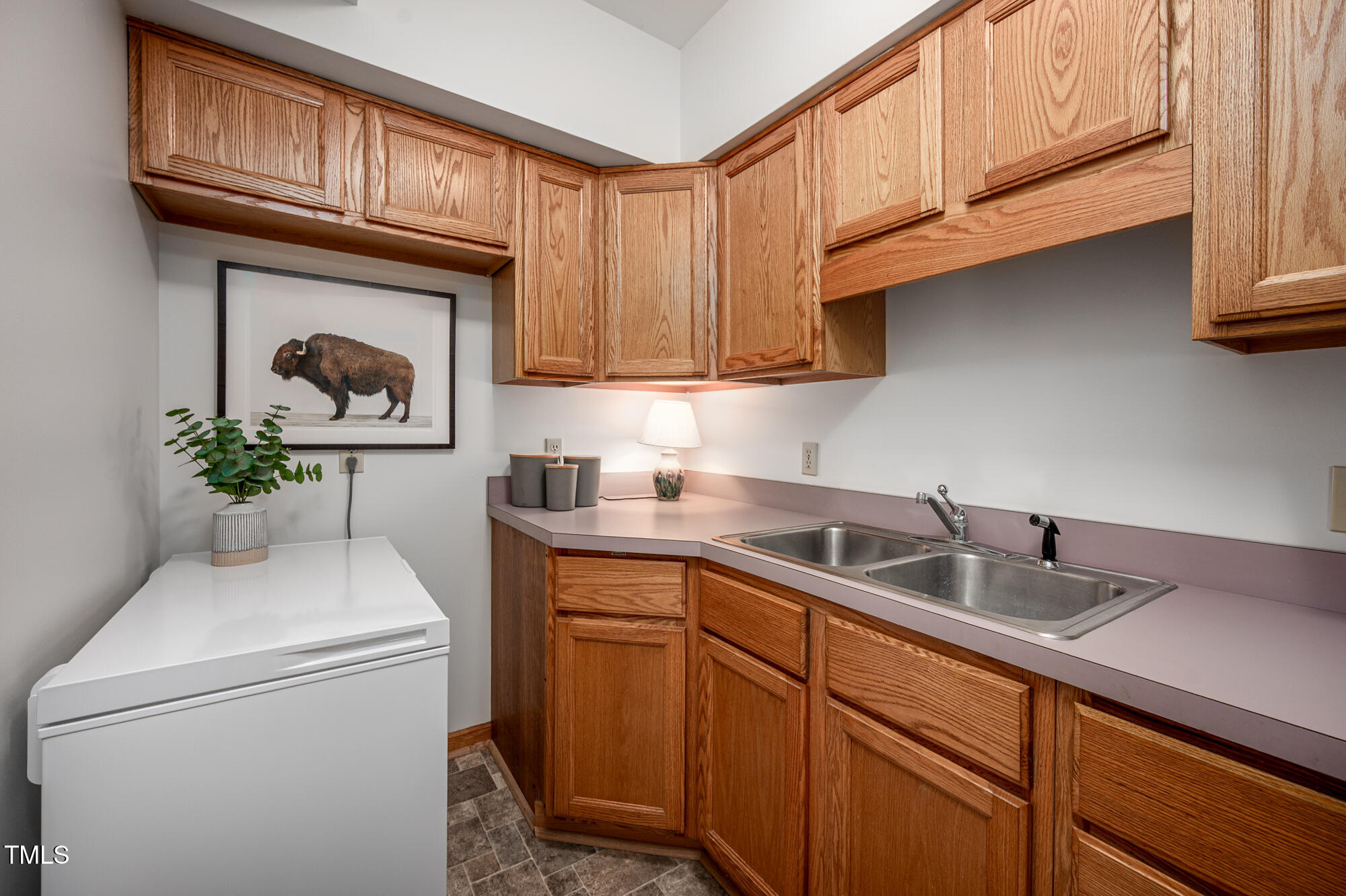 7723 Johnson Mill Road Bahama, NC 27503 - Photo 33 of 58 a kitchen with stainless steel appliances granite countertop a sink a stove and cabinets