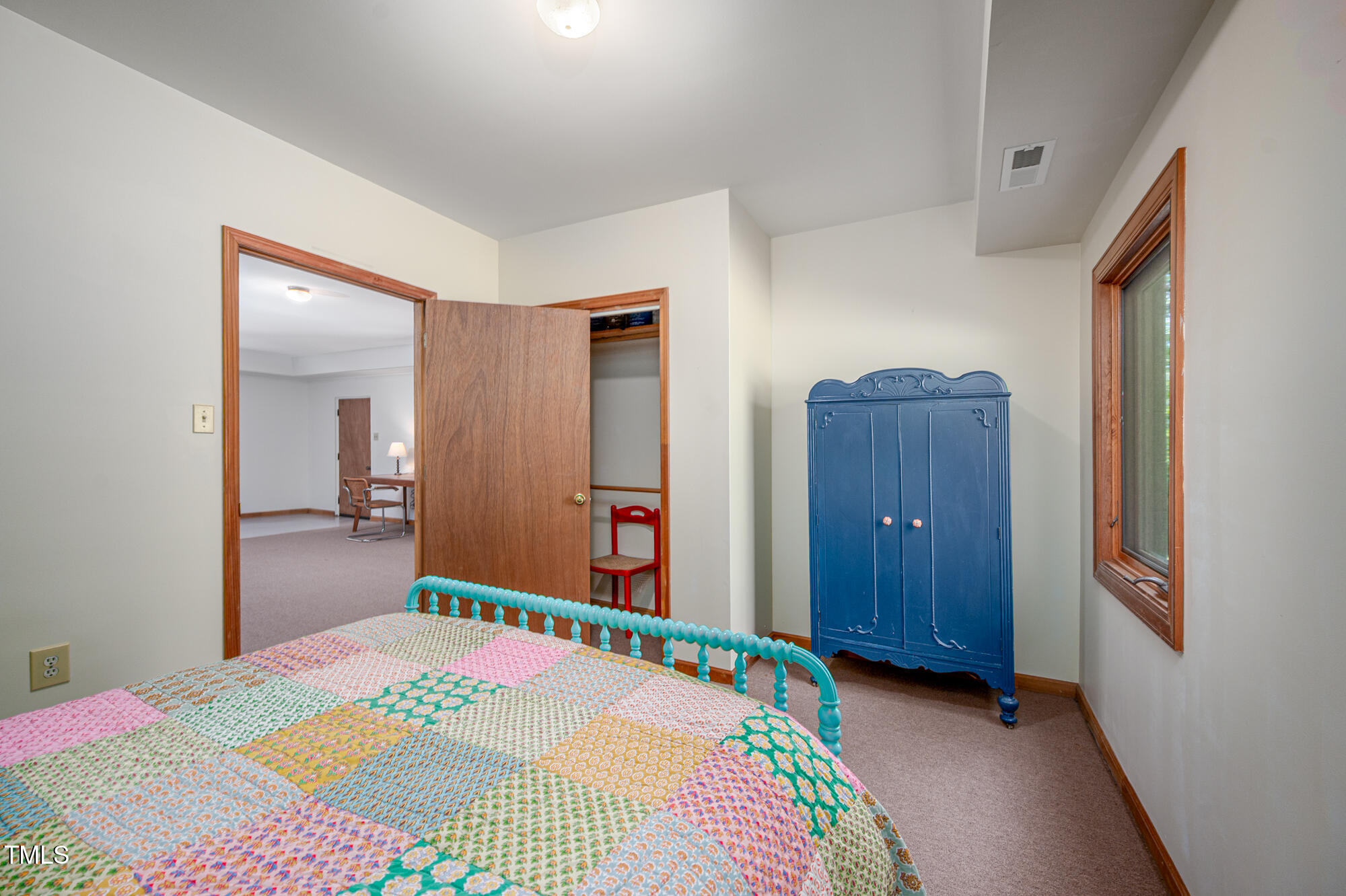 7723 Johnson Mill Road Bahama, NC 27503 - Photo 35 of 58 a bedroom with a bed and a dresser