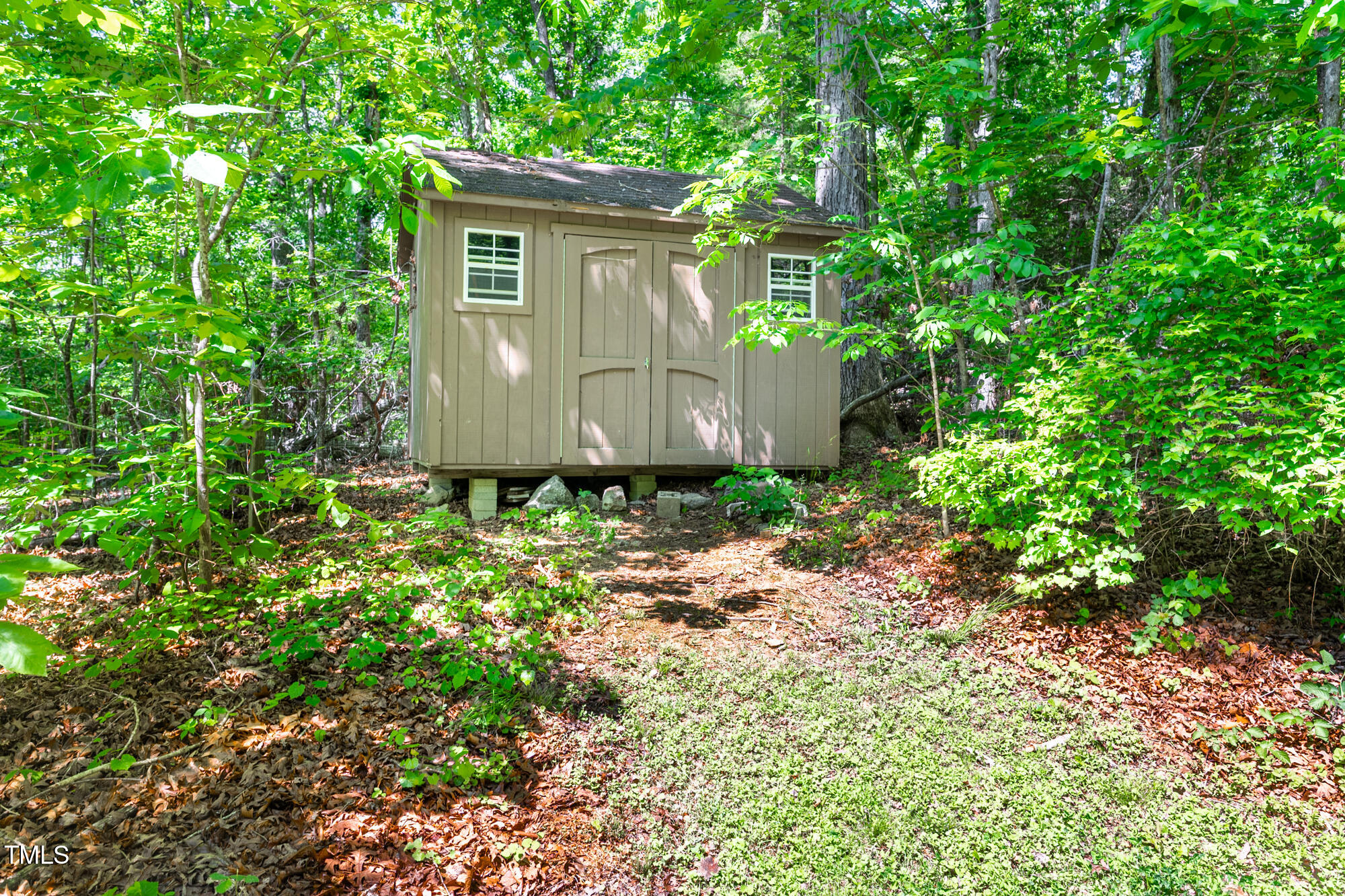 7723 Johnson Mill Road Bahama, NC 27503 - Photo 43 of 58 a view of a house with a yard and plants