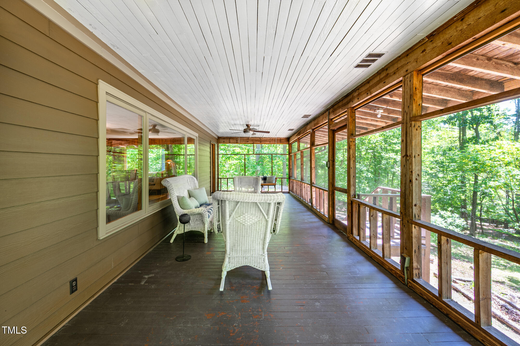 7723 Johnson Mill Road Bahama, NC 27503 - Photo 7 of 58 a view of a patio with table and chairs
