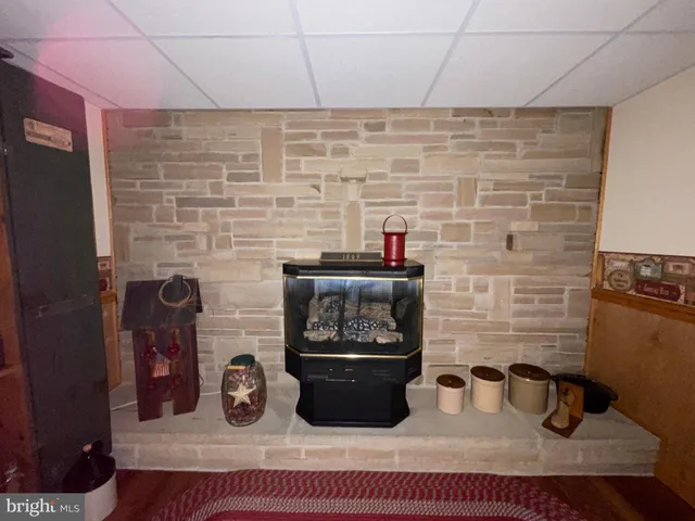 a bathroom with a sink and a wooden floor