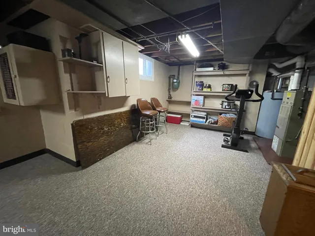 a view of storage and utility room with stairs