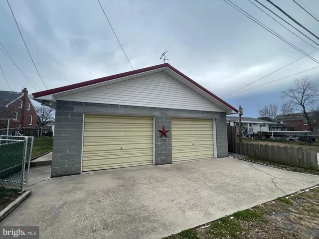 a view of garage and yard