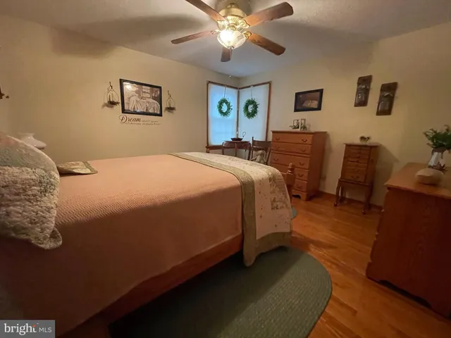a bedroom with bed and window