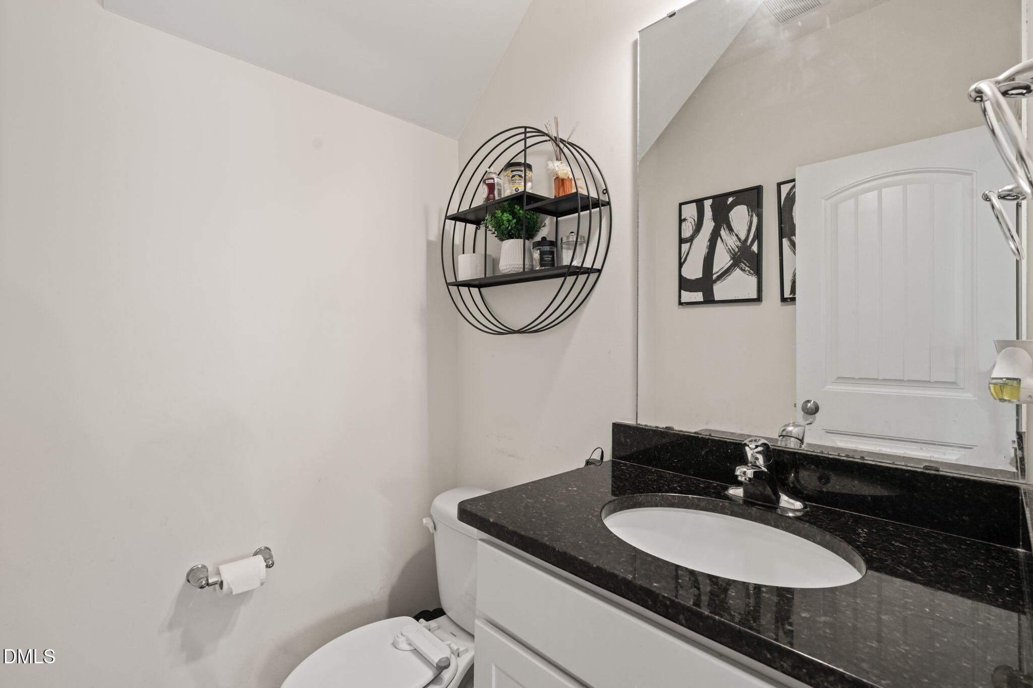 94 Combine Trail Benson, NC 27504 - Photo 36 of 43 a bathroom with a granite countertop sink and a mirror